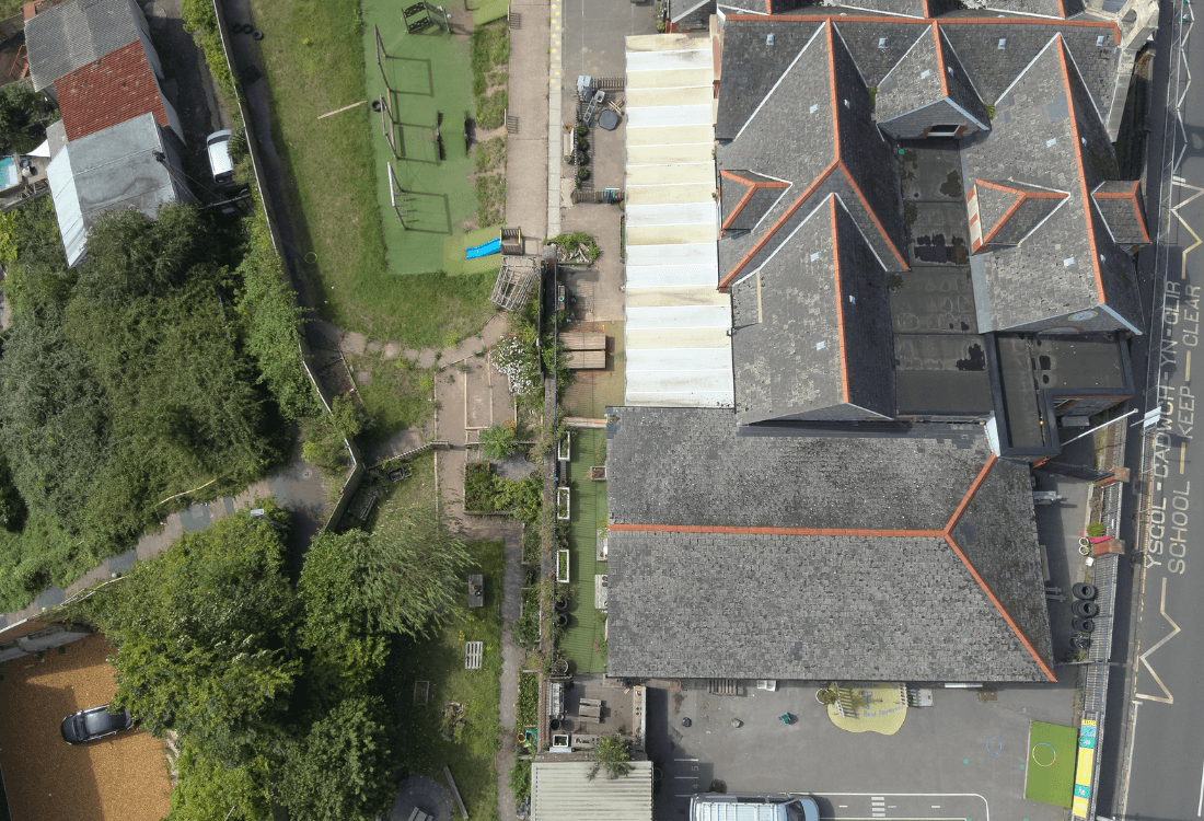 A drone carrying out a roof inspection for a housing association inspection.